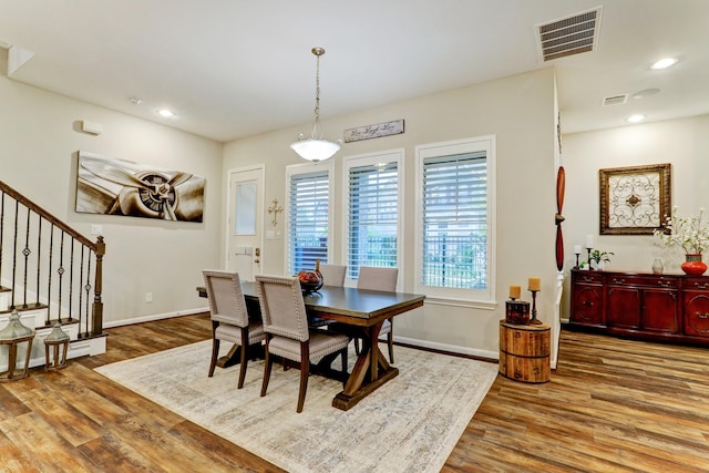 dining area with stairs, recessed lighting, baseboards, wood finished floors, and visible vents