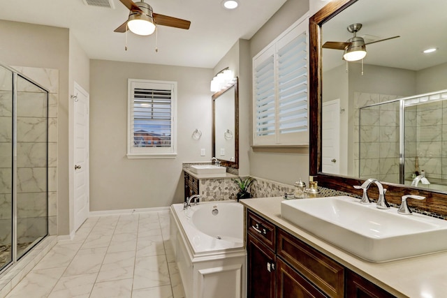 bathroom with a sink, ceiling fan, a shower stall, and marble finish floor