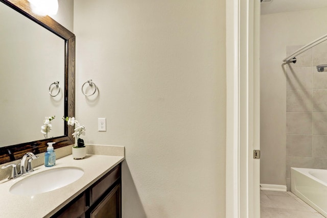 bathroom with tile patterned flooring, bathing tub / shower combination, and vanity