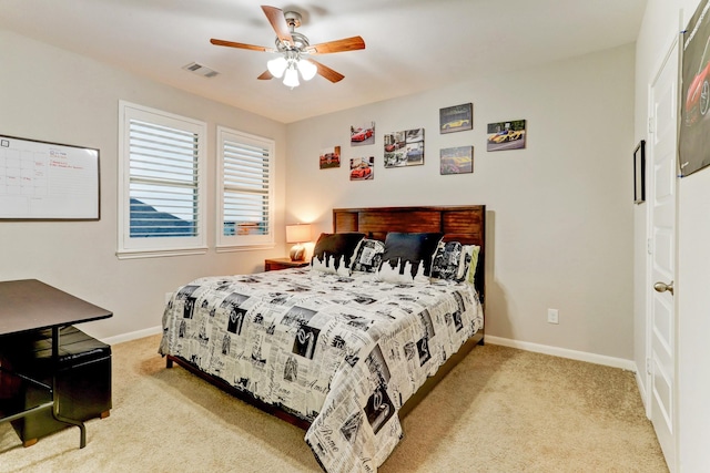 carpeted bedroom featuring visible vents, a ceiling fan, and baseboards