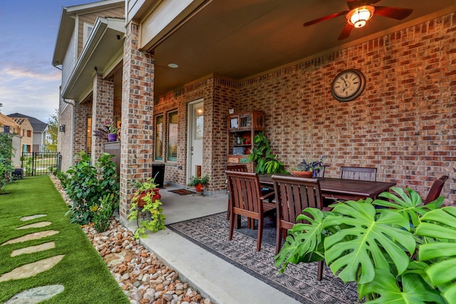 view of patio / terrace featuring fence, a ceiling fan, and outdoor dining area