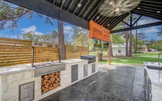 14203 Cypress Creek Blvd, Cypress, TX 77429 - view of patio featuring an outdoor kitchen and grilling area