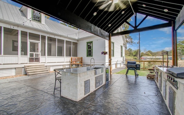 14203 Cypress Creek Blvd, Cypress, TX 77429 - view of patio / terrace with an outdoor kitchen, a sunroom, beverage cooler, and a grill