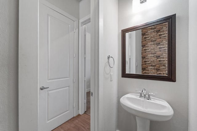 bathroom featuring a sink and wood finished floors