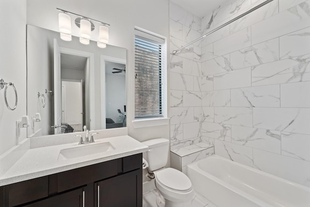 ensuite bathroom with vanity, shower / bathtub combination, toilet, a ceiling fan, and ensuite bathroom