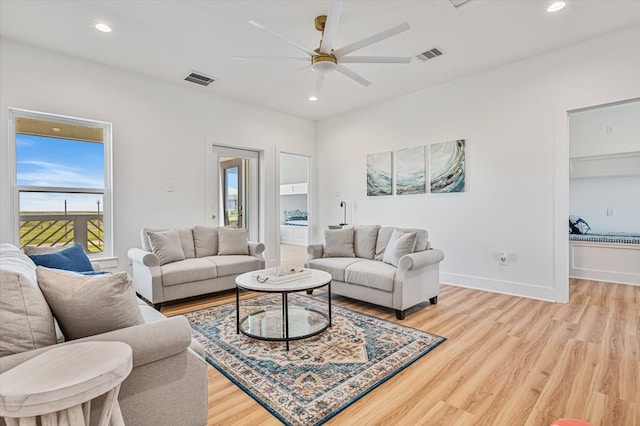 living area with light wood-style floors, ceiling fan, recessed lighting, and visible vents