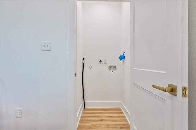 laundry room featuring washer hookup, laundry area, electric dryer hookup, baseboards, and light wood-style flooring