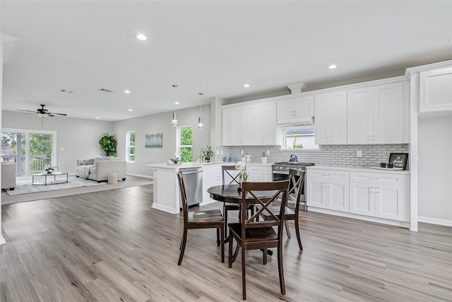 dining space with recessed lighting, ceiling fan, baseboards, and light wood-type flooring