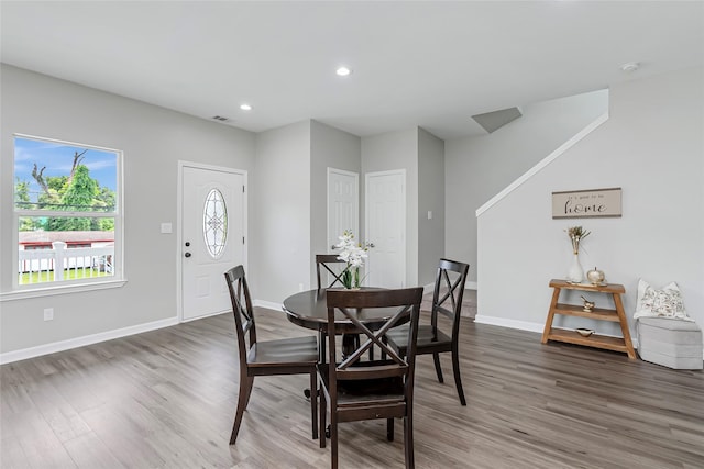 dining area with recessed lighting, baseboards, visible vents, and wood finished floors