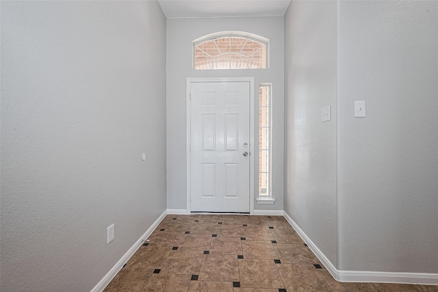 entrance foyer featuring baseboards
