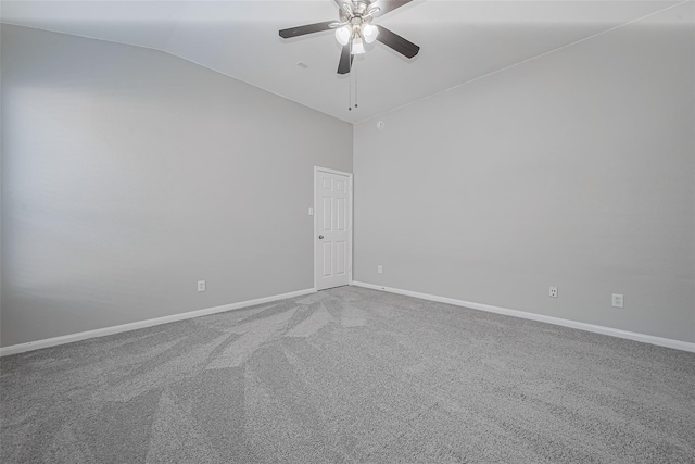 carpeted empty room with baseboards, a ceiling fan, and high vaulted ceiling