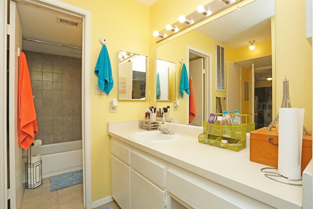 full bathroom with shower / bathtub combination, tile patterned floors, visible vents, and vanity