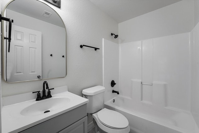 full bathroom featuring vanity, toilet, bathing tub / shower combination, and visible vents