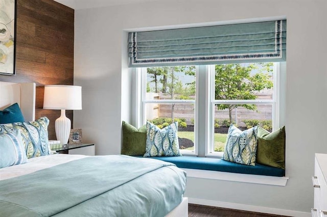 bedroom with wood finished floors