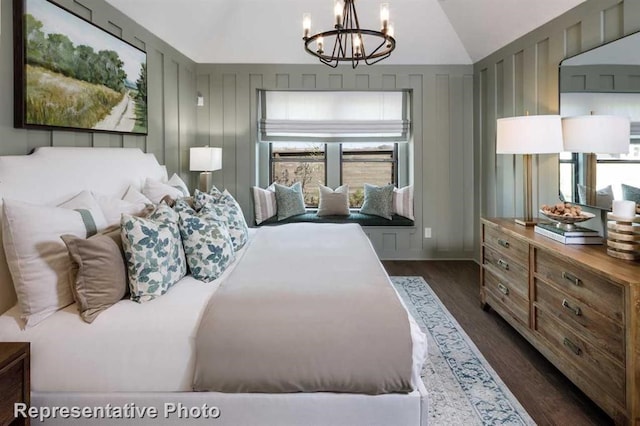 17708 Monarch Vista Ln, Conroe, TX 77302 - bedroom with dark wood-type flooring, a chandelier, and lofted ceiling
