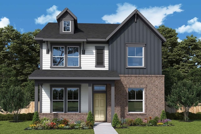 view of front facade with board and batten siding, brick siding, fence, and roof with shingles