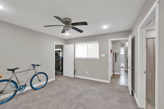 interior space with baseboards, ceiling fan, carpet flooring, and recessed lighting
