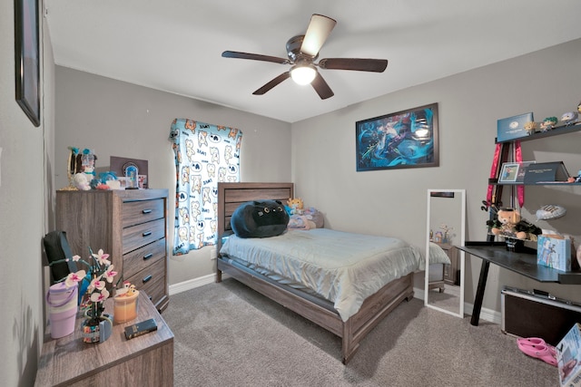 carpeted bedroom featuring a ceiling fan and baseboards