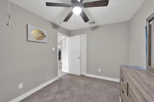 carpeted bedroom featuring visible vents, a ceiling fan, and baseboards