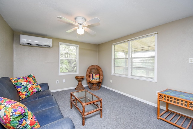 carpeted living area with baseboards, a ceiling fan, and a wall unit AC