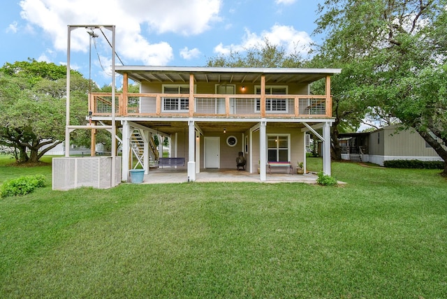 back of house featuring a patio, a yard, a deck, and stairway