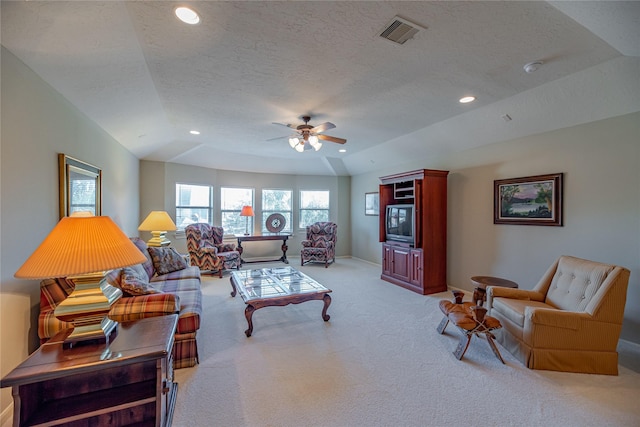 living area with a ceiling fan, visible vents, light carpet, and recessed lighting