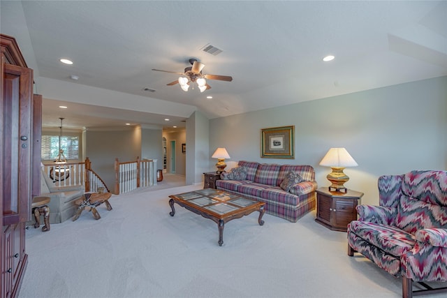 carpeted living area with a ceiling fan, recessed lighting, and visible vents
