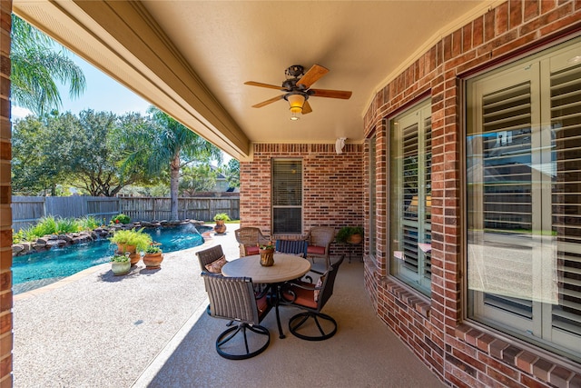 view of patio / terrace with a fenced in pool, a ceiling fan, and a fenced backyard