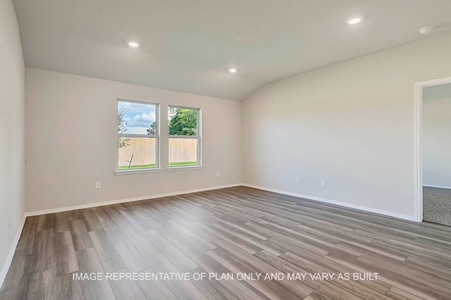 unfurnished room with recessed lighting, baseboards, wood finished floors, and lofted ceiling