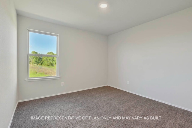 unfurnished room featuring baseboards and carpet