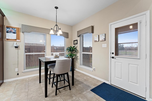 dining space with light tile patterned flooring and baseboards