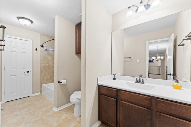 bathroom with a notable chandelier, vanity, toilet, tile patterned floors, and  shower combination
