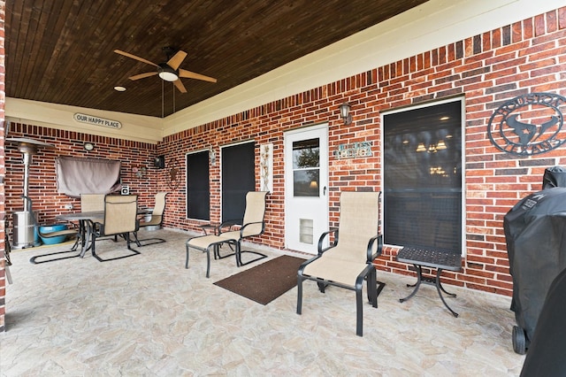 view of patio / terrace featuring outdoor dining space, ceiling fan, and grilling area