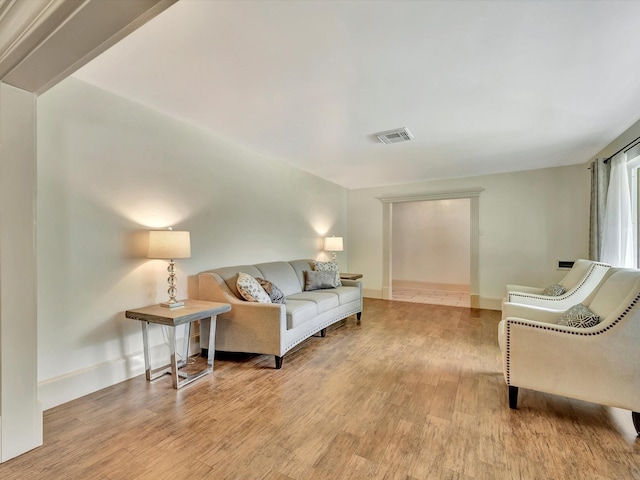 living room with wood finished floors and baseboards