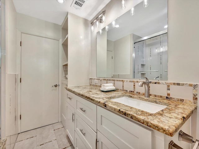 full bathroom featuring a stall shower, tile patterned flooring, recessed lighting, and vanity