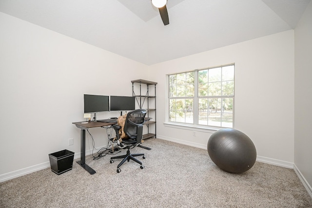 carpeted office space with vaulted ceiling, baseboards, and a ceiling fan