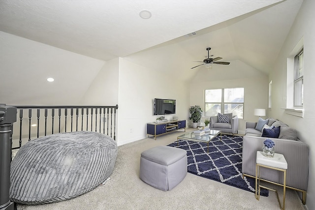 living room featuring ceiling fan, visible vents, vaulted ceiling, baseboards, and carpet flooring
