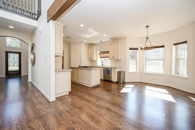 kitchen featuring dark wood-style flooring, a center island, dishwasher, a chandelier, and recessed lighting