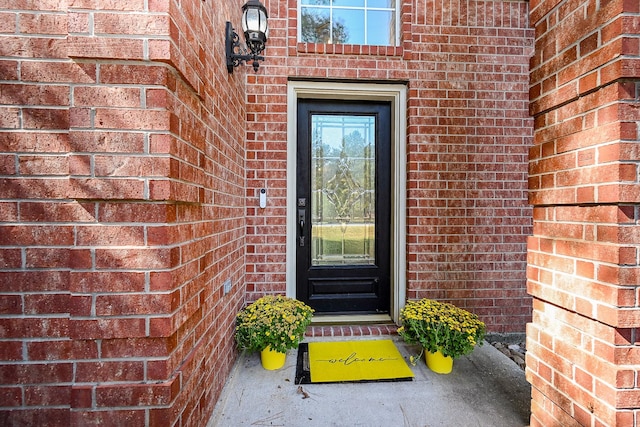 entrance to property with brick siding