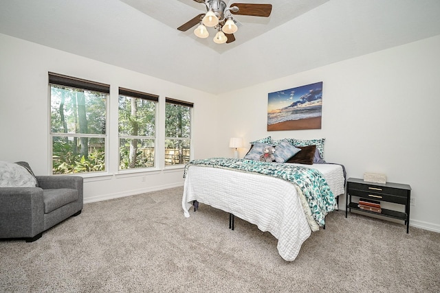carpeted bedroom featuring baseboards and ceiling fan