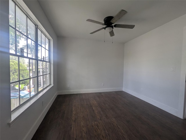 804 Ward St, Rosenberg, TX 77471 - spare room featuring healthy amount of natural light, dark wood-type flooring, a ceiling fan, and baseboards