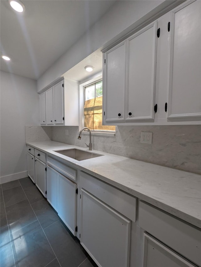 804 Ward St, Rosenberg, TX 77471 - kitchen with a sink, tasteful backsplash, white cabinetry, baseboards, and recessed lighting