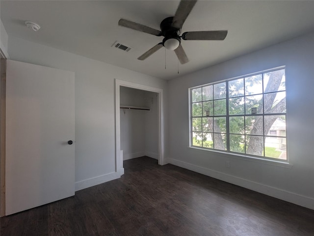 804 Ward St, Rosenberg, TX 77471 - unfurnished bedroom with dark wood-style flooring, a closet, and a ceiling fan