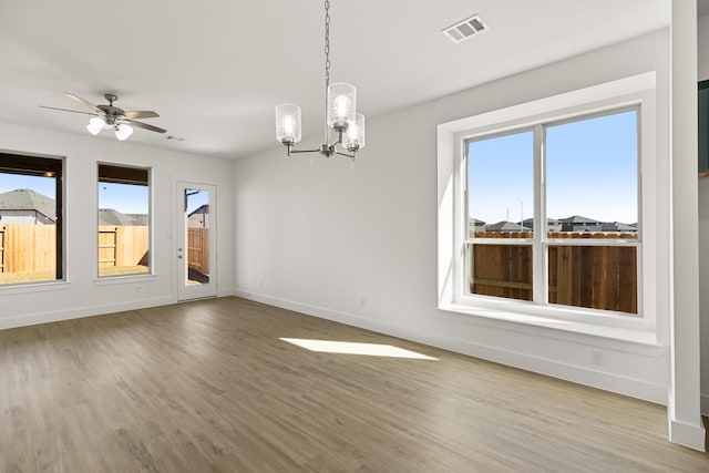2219 Inglenook Grove Dr, Katy, TX 77493 - unfurnished room featuring a chandelier, wood finished floors, baseboards, and ceiling fan