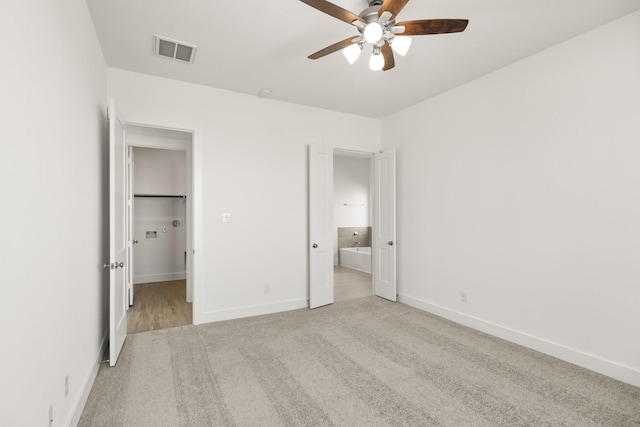 2219 Inglenook Grove Dr, Katy, TX 77493 - unfurnished bedroom featuring carpet flooring, baseboards, ensuite bathroom, and a ceiling fan