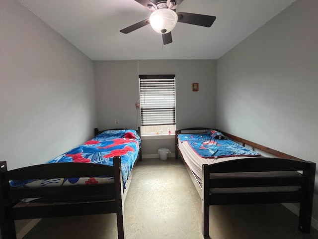 carpeted bedroom with baseboards and a ceiling fan