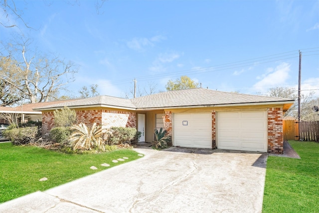 ranch-style home with fence, a front lawn, brick siding, a garage, and concrete driveway