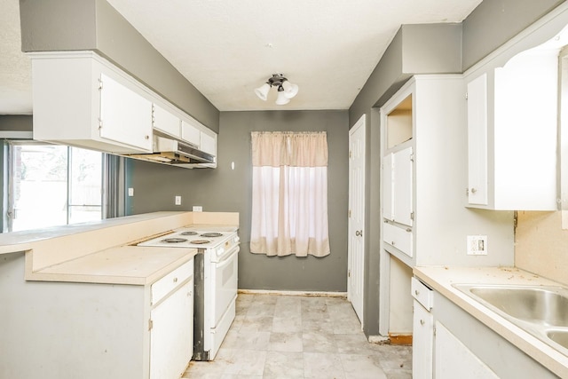 kitchen featuring light countertops, white range with electric stovetop, under cabinet range hood, and a healthy amount of sunlight