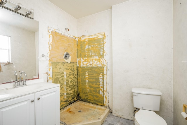 full bathroom with vanity, a stall shower, and toilet
