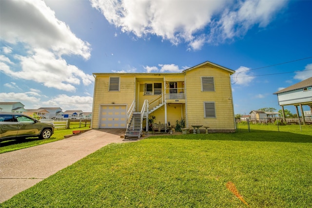 view of front facade featuring fence, stairs, a front lawn, a garage, and concrete driveway